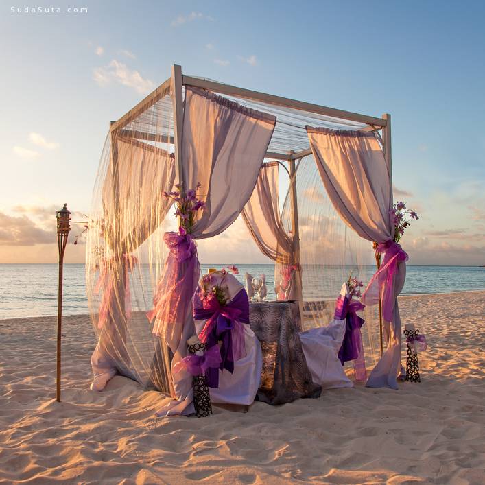 Beautiful Decorated Romantic Wedding Table on Sandy Tropical Caribbean Beach at Sunset