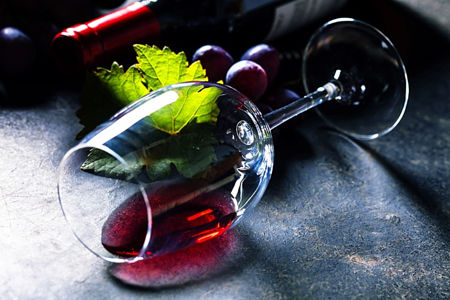 Glass of red wine on dark background